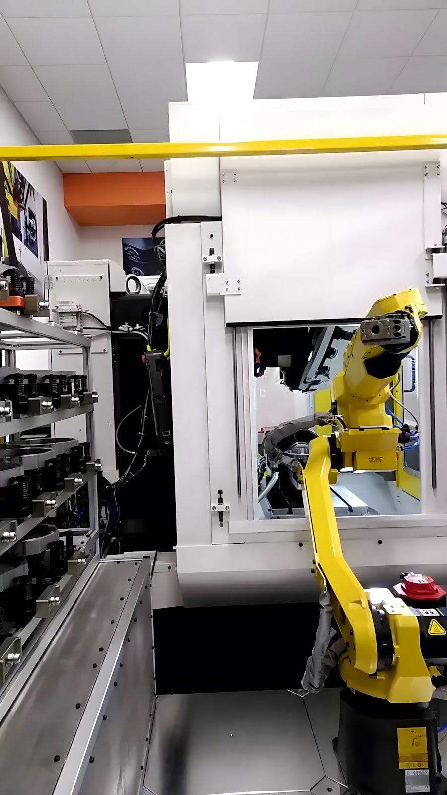 Industrial robot arm operating on a manufacturing line